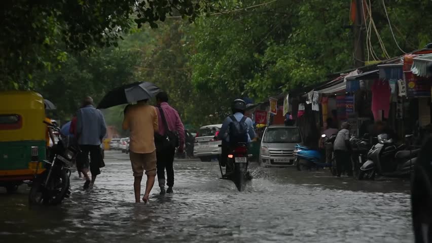 Commuters Wade Through Waterlogged Stretch New Editorial Video