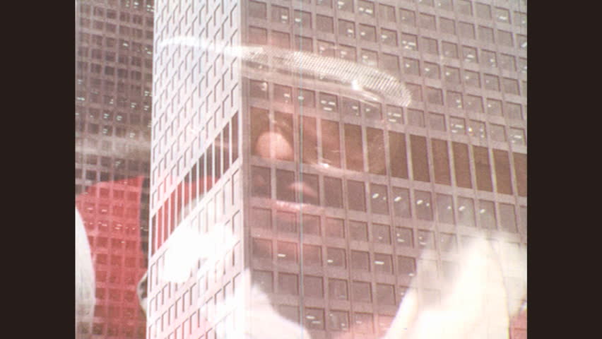 1970s Tall Building Downtown Woman Holds Editorial Video 10939909a 1970s-tall-building-downtown-woman-holds-editorial-video-10939909a