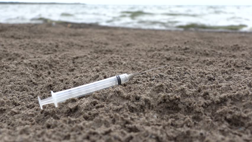 Drug Injection Needle Syringe On Sand | Editorial Video | 13351992t ...